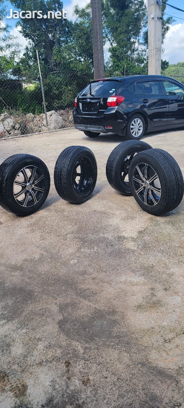 16 inch 5 lug universal rim with tire used-1