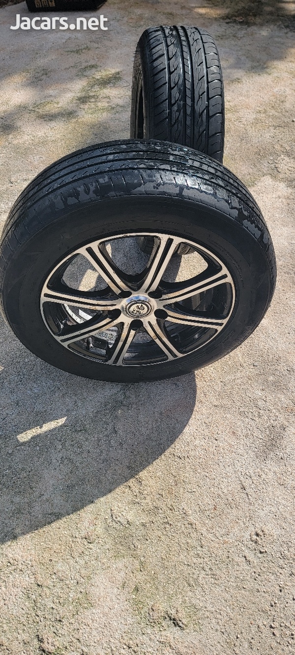 16 inch 5 lug universal rim with tire used-2